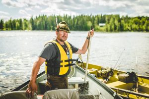 Wilderness Guide Teijo Haapakoski in a Fishing boat.